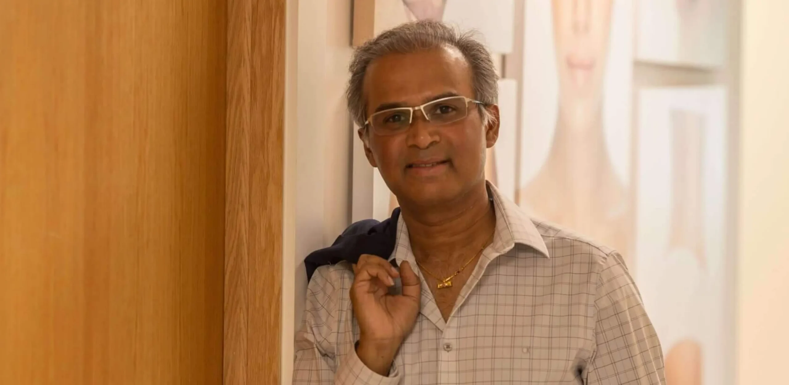 Dr. Shashi Kusuma, founder of Symplast, at his desk