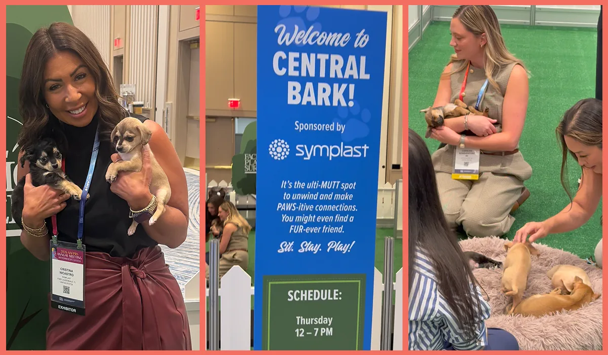 Attendees playing with puppies at Central Bark, sponsored by Symplast at AAFPRS 2026