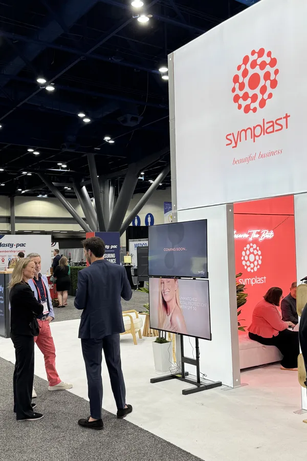 A Vrtly coming soon screen beside the Symplast booth at PSTM 2026