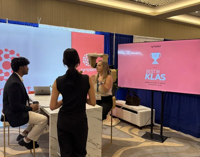 Attendees at the Symplast booth at TSPS 2026, with Best in KLAS signage behind them