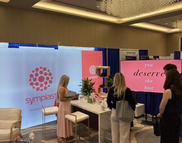 Conversations at the Symplast booth during TSPS 2026